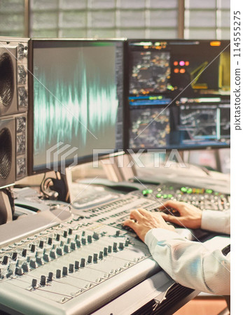 Recording engineer's hands 1 114555275