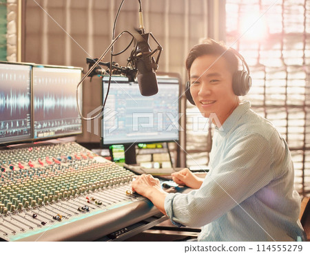 Recording engineer 2 monitoring the recorded song 114555279
