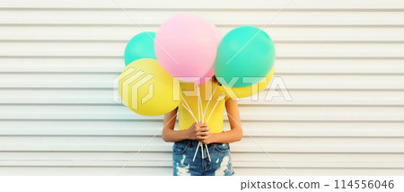Summer, holiday, celebration, happy cheerful woman with bright colorful balloons on white background Summer, holiday, celebration, happy cheerful woman with bright colorful balloons on white background 114556046
