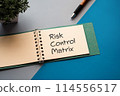 There is a notebook with the words Risk Control Matrix written on it. 114556517