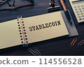There is a notebook with the word Stablecoin written on it, as shown in the eye-catching image. 114556528