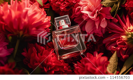 Perfume bottle with beautiful flowers. Floral background. Beauty concept. Flat lay, top view. 114556703