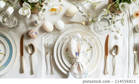 Easter table setting with painted eggs, spring flowers and crockery. Rustic style, selective focus 114556923
