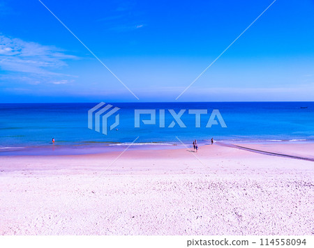 Amazing sea beach with ocean wave foams.Beautiful nature beach sand sea surface,Waves crashing on sand,Wide angle lens 114558094