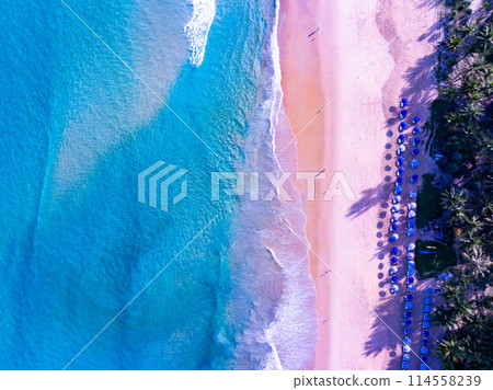 Amazing sea beach with ocean wave foams.Beautiful nature beach sand sea surface,Waves crashing on sand,Wide angle lens 114558239