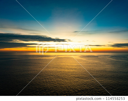 Aerial view sunset sky, Beautiful Light Sunset or sunrise over sea,Colorful dramatic majestic scenery sunset Sky, Amazing clouds and small waves in the ocean, Wonderful light cloud background Aerial view sunset sky, Beautiful Light Sunset or sunrise over sea,Colorful dramatic majestic scenery sunset Sky, Amazing clouds and small waves in the ocean, Wonderful light cloud background 114558253
