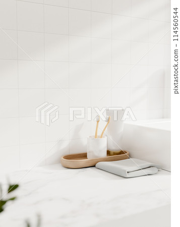 A close-up shot of a toiletry on a white marble bathroom tabletop against the white tile wall. 114560544