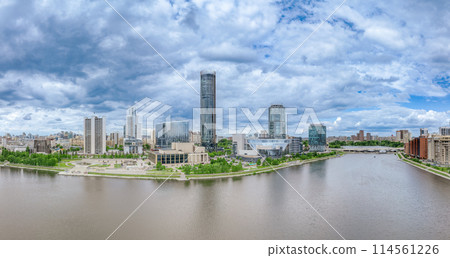 Yekaterinburg city with Buildings of Regional Government and Parliament, Dramatic Theatre, Iset Tower, Yeltsin Center, panoramic view at summer sunset. Yekaterinburg city with Buildings of Regional Government and Parliament, Dramatic Theatre, Iset Tower, Yeltsin Center, panoramic view at summer sunset. 114561226