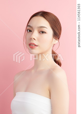 Beautiful young asian woman with clean fresh skin on pink background, Face care, Facial treatment, Cosmetology, beauty and spa, Asian women portrait. Beautiful young asian woman with clean fresh skin on pink background, Face care, Facial treatment, Cosmetology, beauty and spa, Asian women portrait. 114561303