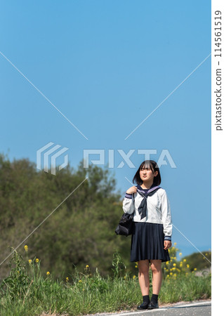 A high school girl going to school on a sunny day 114561519