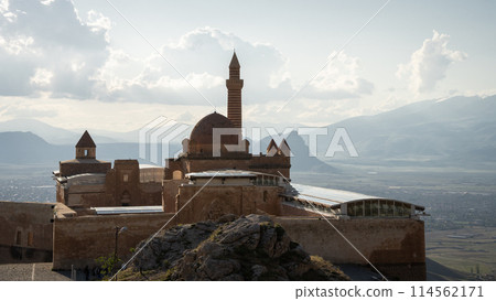 Historical Arabian palace with minarets overlooking city in the valley beneath, Eastern Turkey 114562171