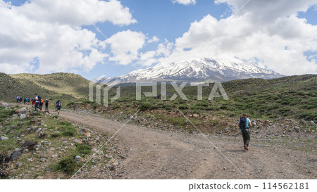 Hikers walking to the basecamp with snowy mountain summit in backdrop, Mount Ararat in Turkey 114562181
