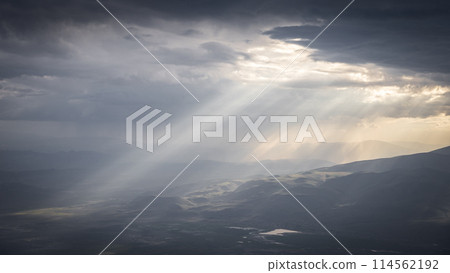Beautiful mountainous landscape hit by beams of sunlight shining through the clouds, Mount Ararat 114562192