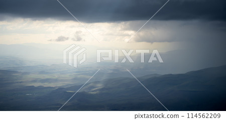 Highlands landscape with mountains, thick clouds and soft sunlight, Mount Ararat in Turkey 114562209