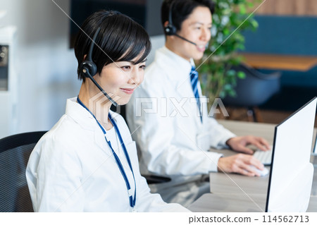 A medical professional operator wearing a white coat A medical professional operator wearing a white coat 114562713