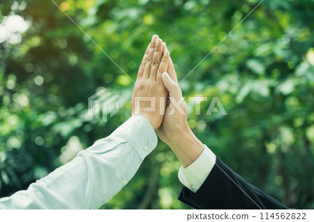 Group of volunteer people joining for cooperation about global community teamwork with join hand together, World environment day, sustainable development goal. 114562822