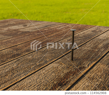 A nail sticks out of the board A nail sticks out of the board 114562908