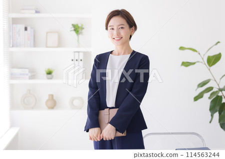 Portrait of a woman in a business suit Portrait of a woman in a business suit 114563244