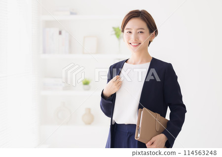Portrait of a woman in a business suit Portrait of a woman in a business suit 114563248