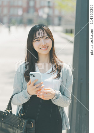 Young woman waiting at the meeting point 114563393