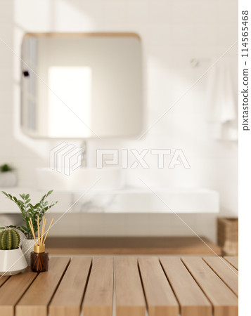 A space for showcasing products on a wooden table in a modern, luxurious white bathroom. A space for showcasing products on a wooden table in a modern, luxurious white bathroom. 114565468