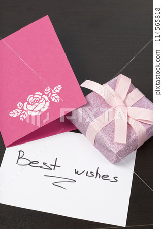 Handmade greeting cards. Near gift in wrapping paper, tied with a ribbon. Original gift. 114565818