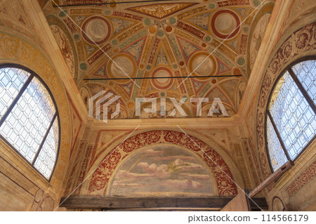 The ceiling of a church is decorated with a variety of designs and patterns The ceiling of a church is decorated with a variety of designs and patterns 114566179