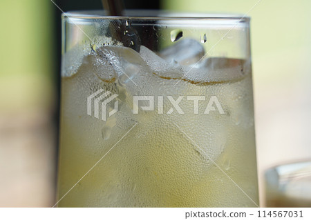 Refreshing lemonade in a glass on a table in a cafe 114567031