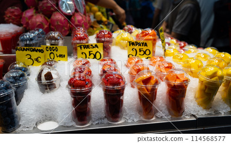 Blueberries, strawberries, coconut, pineapple, papaya in a plastic glass. Convenience, healthy lifestyle. Variety of fruits at farmers market Blueberries, strawberries, coconut, pineapple, papaya in a plastic glass. Convenience, healthy lifestyle. Variety of fruits at farmers market 114568577