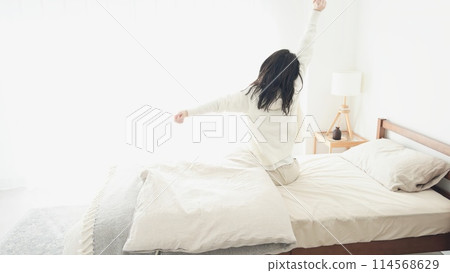 A woman waking up and growing 114568629