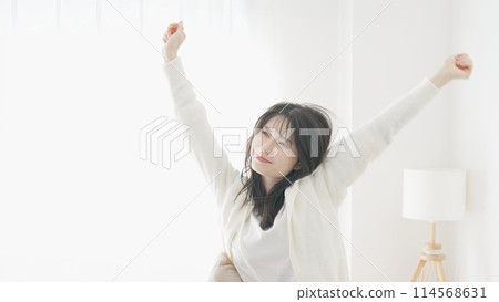 A woman waking up and growing 114568631