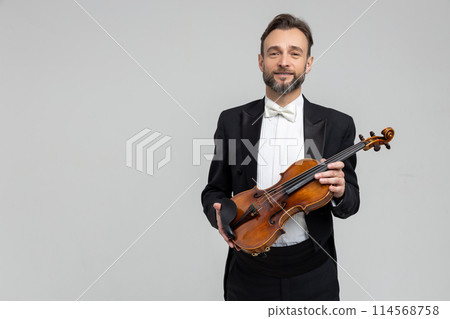 Bearded musician performed violin at classical music concert Bearded musician performed violin at classical music concert 114568758
