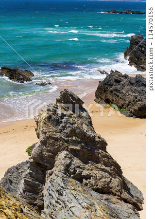 Atlantic ocean coastline with rocks, light sand and turquoise water 114570156