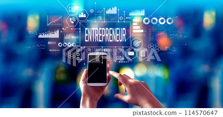 Entrepreneur theme with person using a smartphone at night 114570647