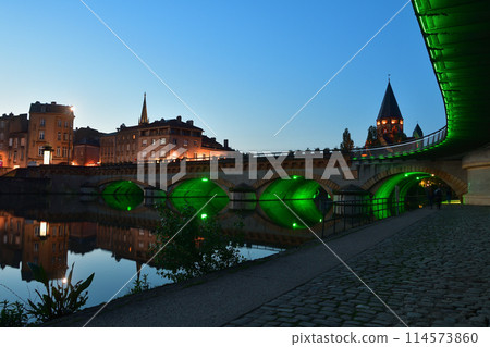 Metz, France. Night view of the Moyen-Pont bridge over the Moselle river on May 11, 2024. Metz, France. Night view of the Moyen-Pont bridge over the Moselle river on May 11, 2024. 114573860