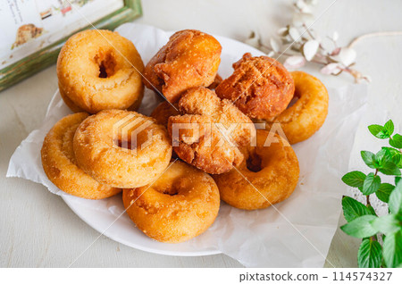 Fried confectionery donuts 114574327