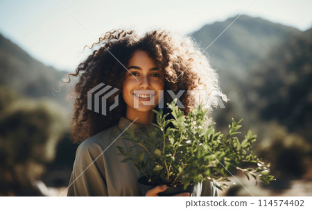 Agriculture, Portrait of a young woman farmer entrepreneur with a plant organic natural vegetables 114574402