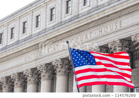 USA national flag waving in the wind in front of United States Court House in New York USA national flag waving in the wind in front of United States Court House in New York 114576260