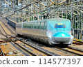 A Shinkansen train passing through Nasushiobara Station at high speed 114577397
