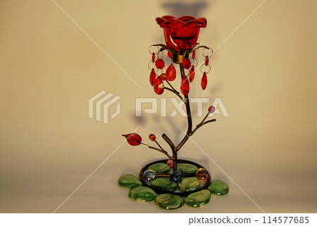 Candlestick in the shape of a flower.With a red bud and decorated with green stones. 114577685