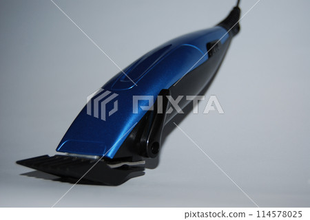 Hair clipper. With electric drive.Hairdressing tool. Hair shaving machine. Blue-black colour.      114578025
