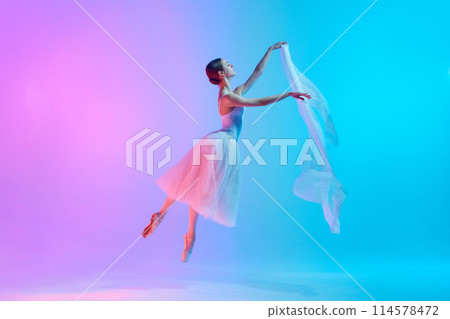 Dynamic portrait of young ballerina dancing with fabric in neon light against vivid gradient background. Elegance. Dynamic portrait of young ballerina dancing with fabric in neon light against vivid gradient background. Elegance. 114578472