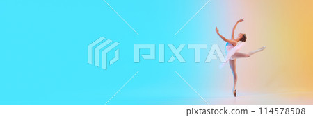 Banner. Charming ballerina in white tutu doing arabesque, reaching upwards in neon light against blue-orange gradient background. Banner. Charming ballerina in white tutu doing arabesque, reaching upwards in neon light against blue-orange gradient background. 114578508
