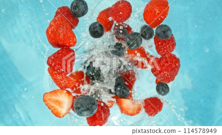 Freeze Motion of Berries Falling into Water, Splashing. Freeze Motion of Berries Falling into Water, Splashing. 114578949