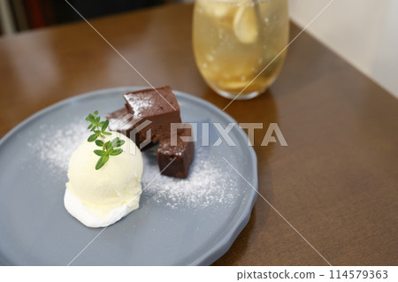 Fresh chocolate cake with vanilla ice cream Fresh chocolate cake with vanilla ice cream 114579363