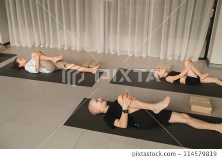 Children do Yoga in the fitness room. Children's gymnastics 114579819