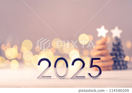 Metal numbers 2025 on table with bokeh lights. Metal numbers 2025 on table with bokeh lights. 114580209