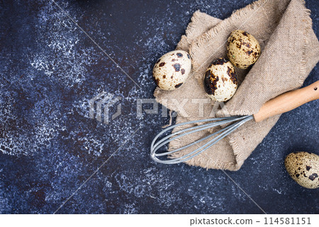 Quail eggs on blue background 114581151