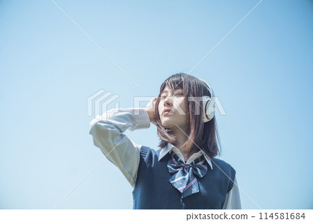 Headphones and schoolgirl 114581684