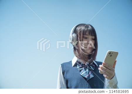 Headphones, smartphone and high school girl 114581695
